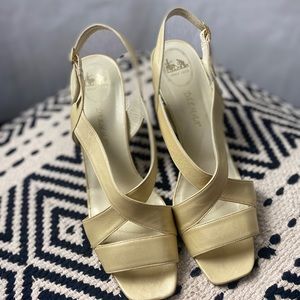DELMAN gold sling backs.